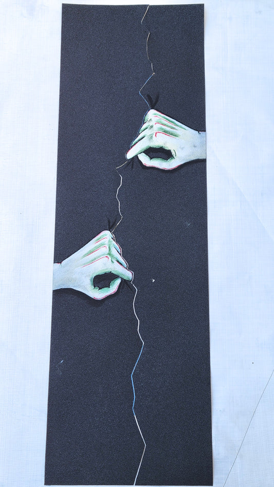 Hands Tearing grip tape sheet