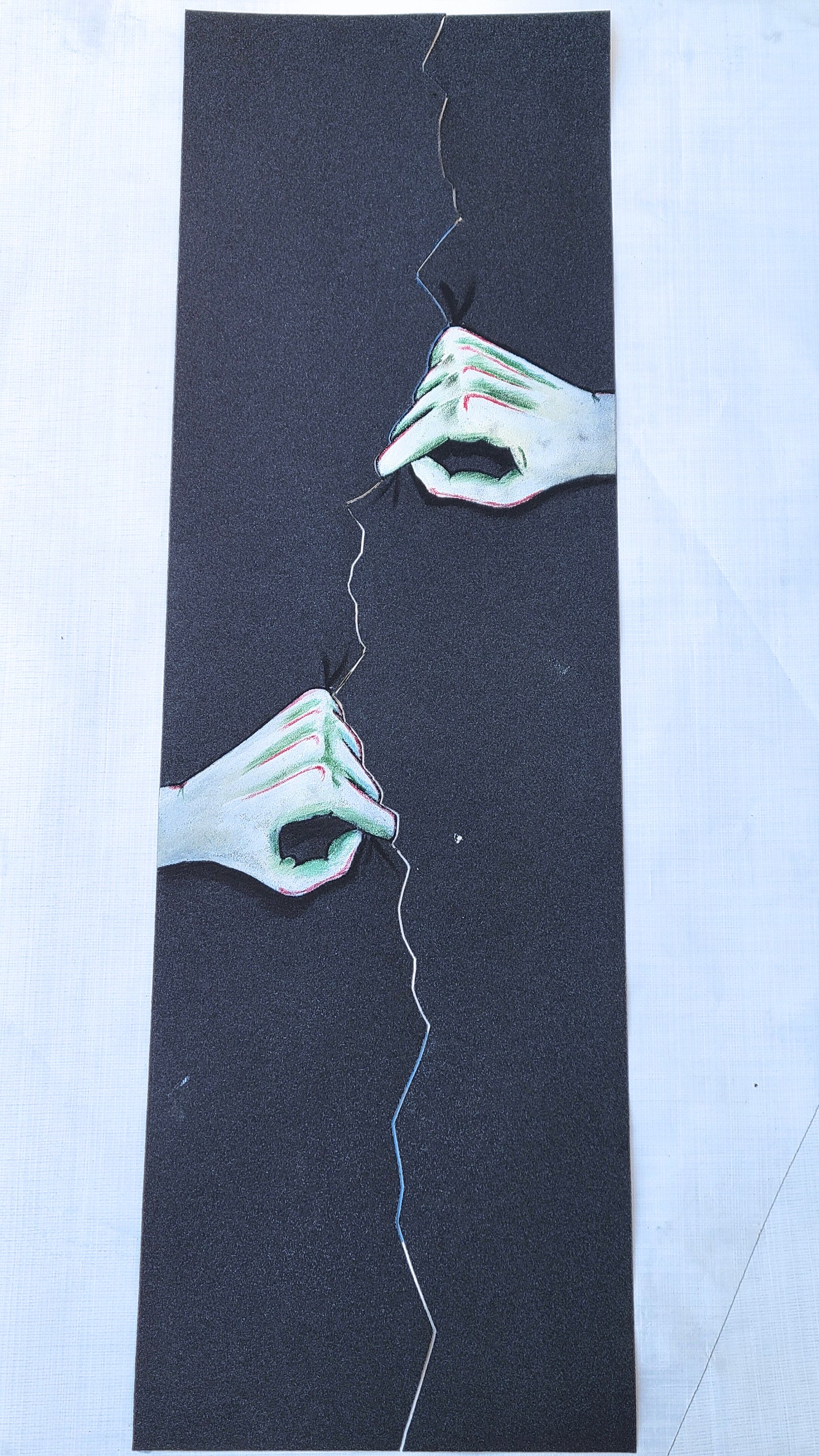 Hands Tearing grip tape sheet