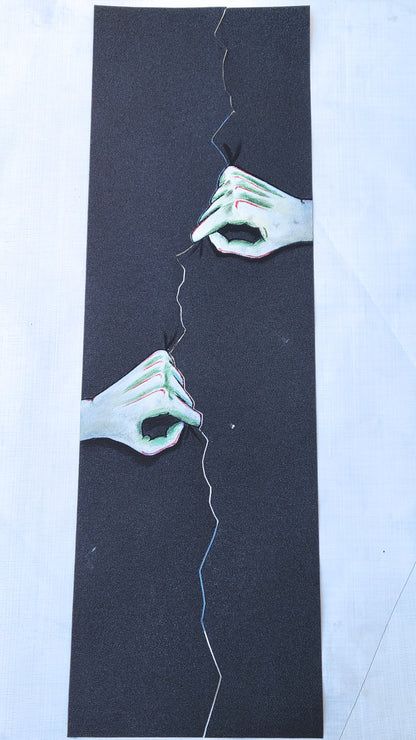 Hands Tearing grip tape sheet